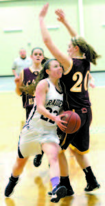 JULIA QUINN of Fryeburg Academy takes the ball strong to the hoop against Cape Elizabeth's Hannah Sawyer. (Rivet Photos)