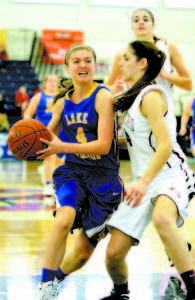 REWARDED FOR HER AGGRESSIVENESS â€” Lake Region guard Kristen Huntress was awarded a pair of foul shots after this drive to the hoop against Greely's Molly Chapin. (Rivet Photos)