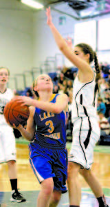 TOUGH TO SHOOT OVER is what Laker guard CeCe Hancock discovered when she was met by Greely center Ashley Storey.