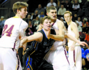 ATTEMPTING TO CARVE OUT SOME SPACE inside the lane is Lake Region senior forward Nick Hall (center), who is guarded by Cape's Finn Bowe (left) and Justin Guerette. (Rivet Photo)